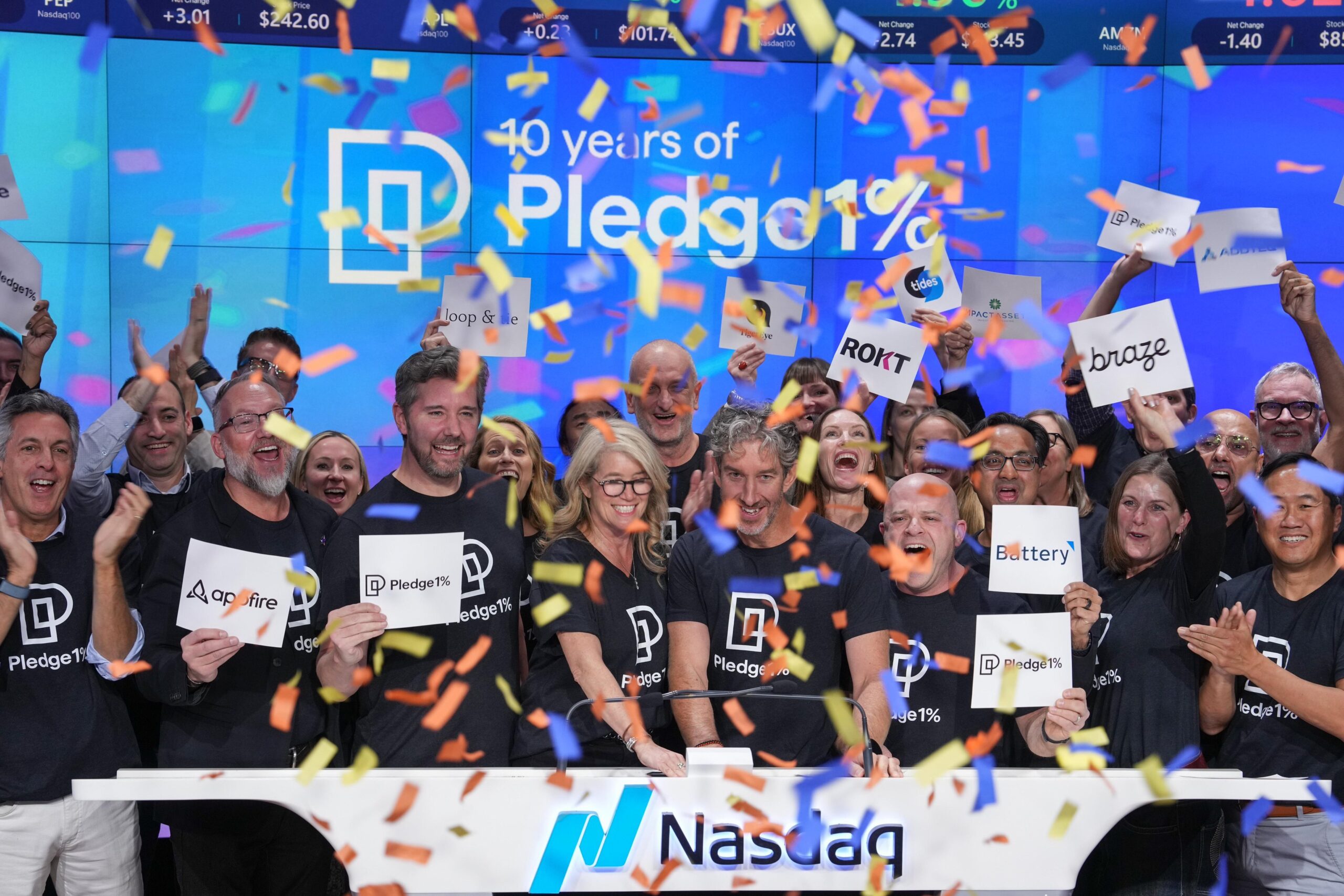 Amy Lesnick and Scott Farquhar ringing the Nasdaq closing bell on Giving Tuesday 2024 to kick off Pledge 1% 10-Yr Anniversary